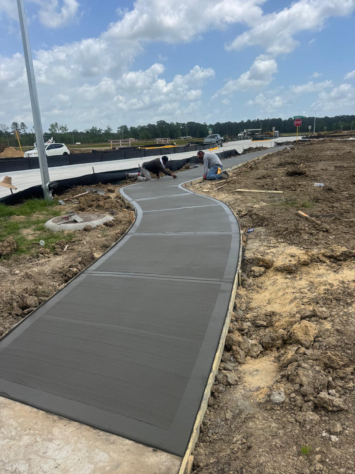 C&C Pro Contractors crew finishing concrete sidewalk